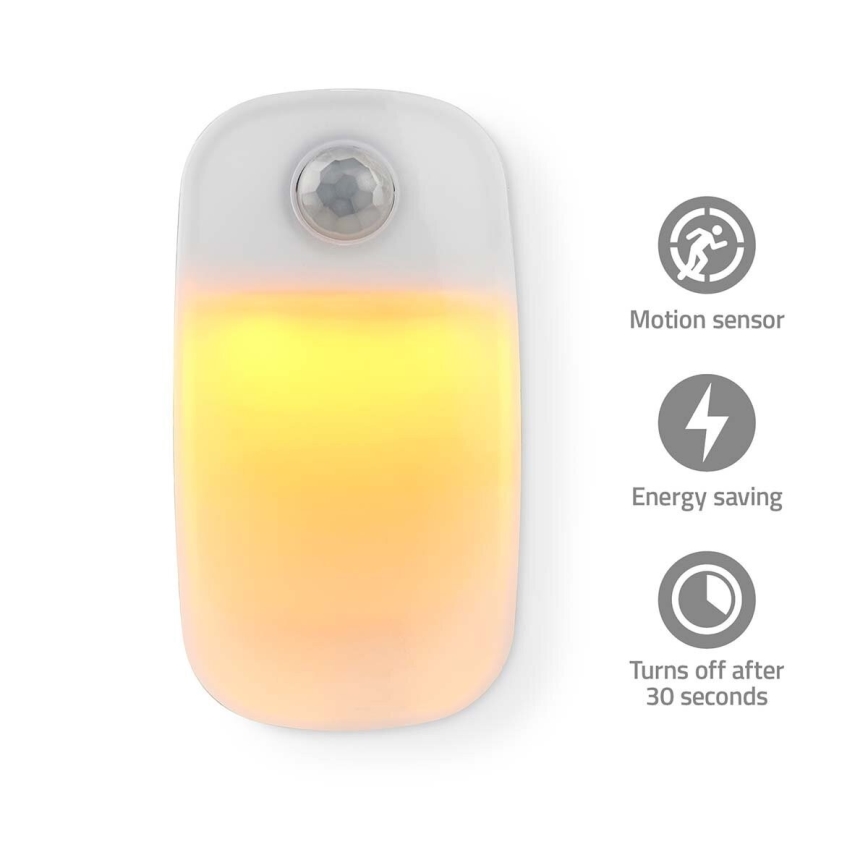LED navigationslampa med stickkontakt med motion och skymningssensor LED/0,55W/230V vit