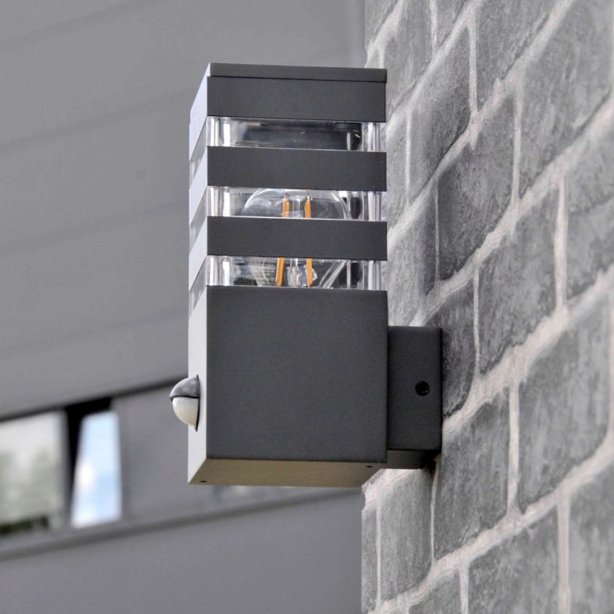 Utomhus vägglampa med sensor TEKSAS 1xE27/12W/230V IP44 antracit