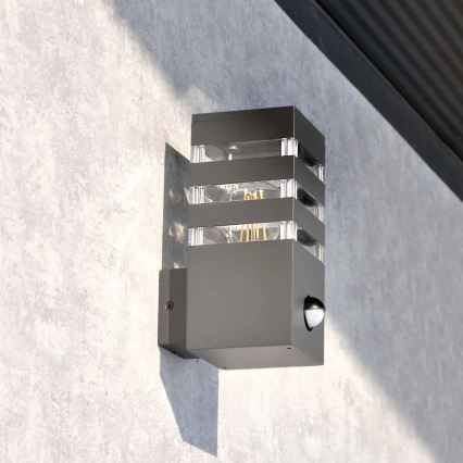 Utomhus vägglampa med sensor TEKSAS 1xE27/12W/230V IP44 antracit